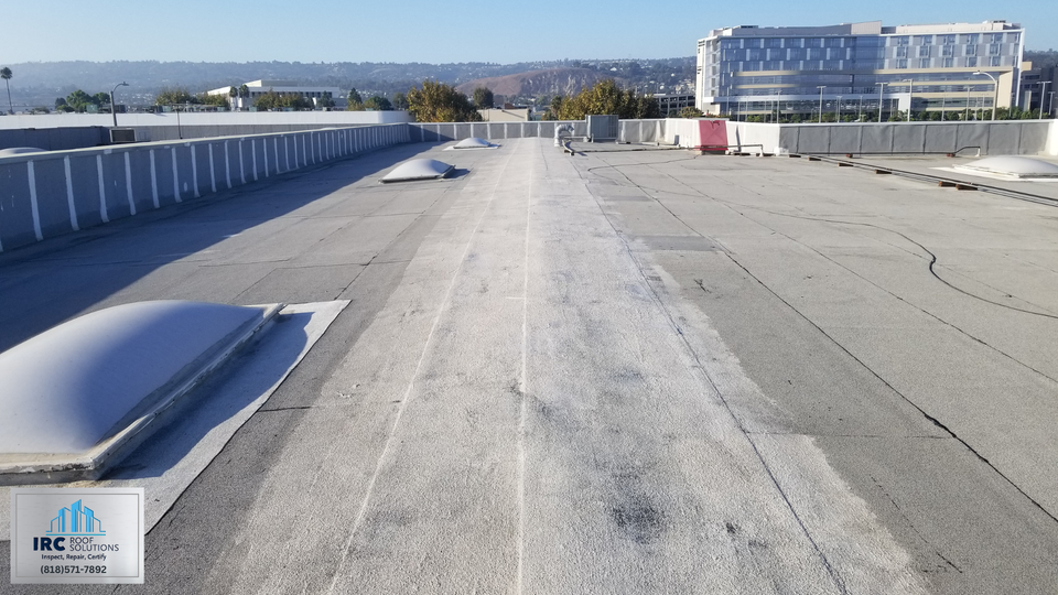 Close inspection view of commercial roof flashings and membrane seams.
