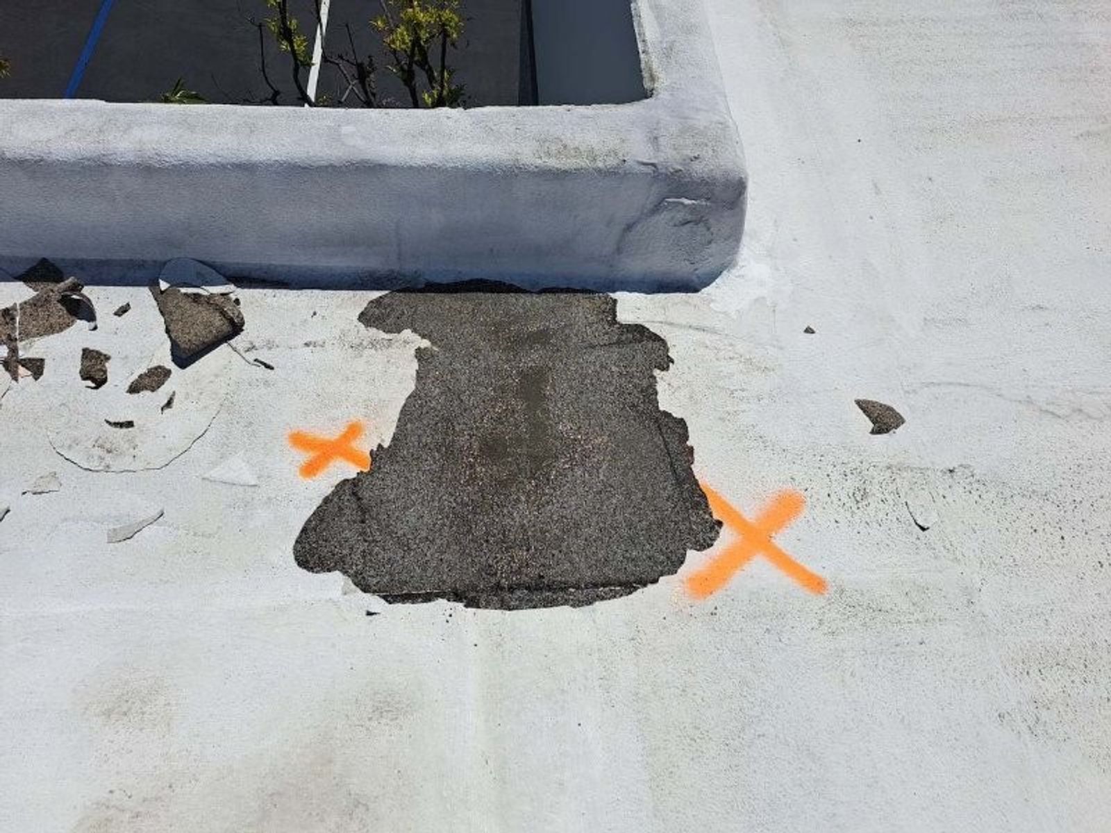 Close detail of acrylic-coated roof surface after cleaning and repair work.