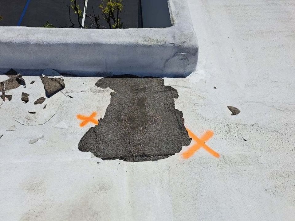 Close detail of acrylic-coated roof surface after cleaning and repair work.